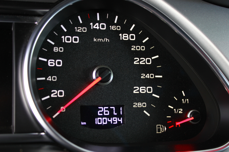 A vehicle's odometer on the dashboard.