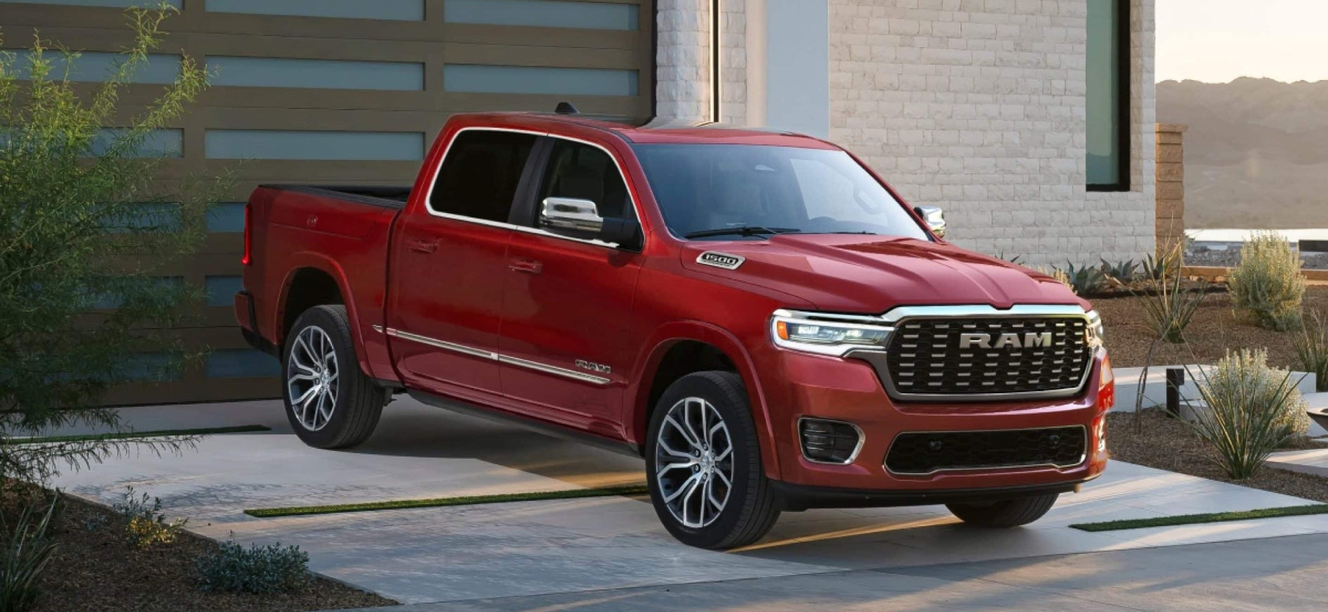 A red RaM 1500 parked in a house's driveway.