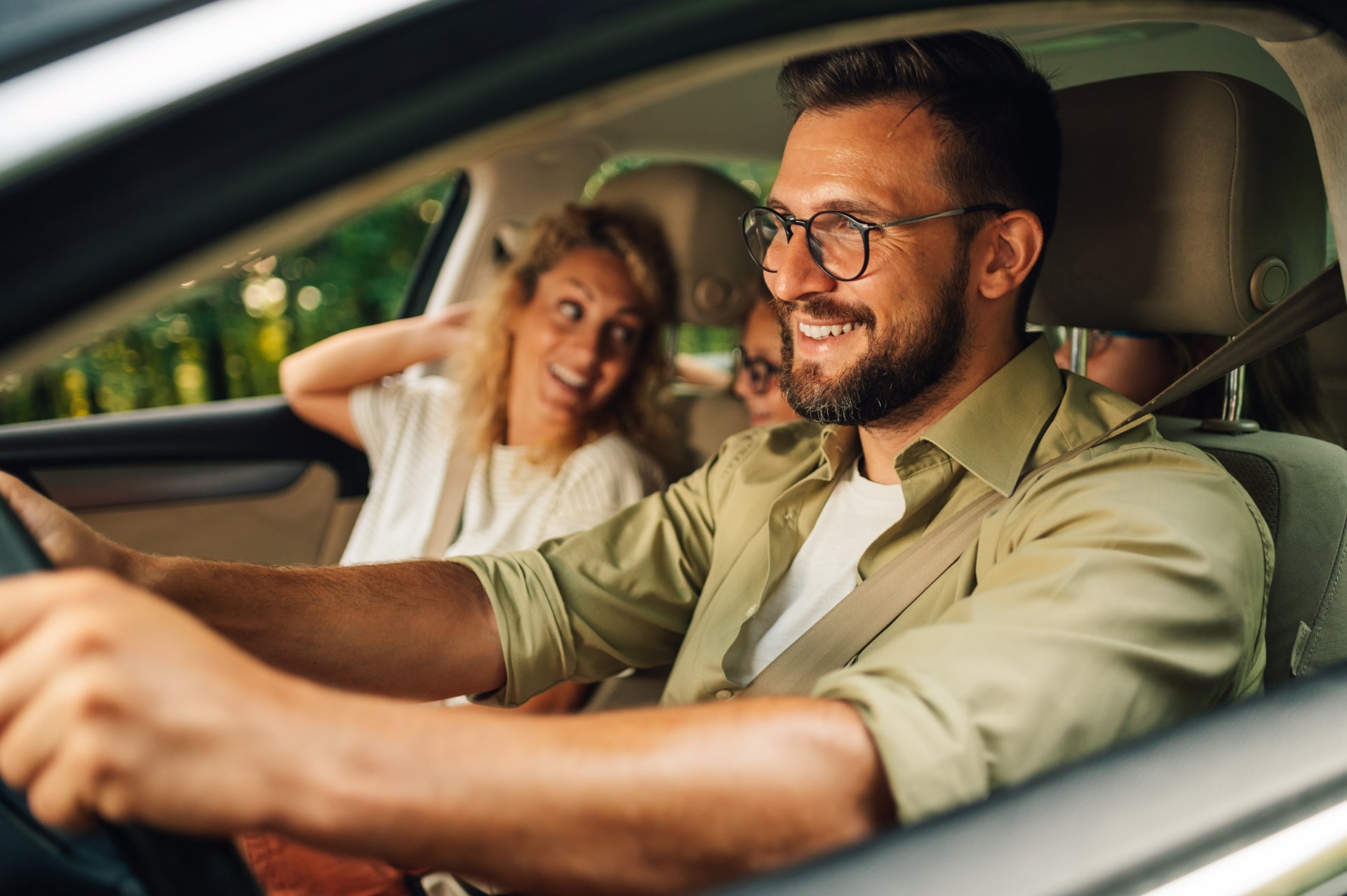 young family enjoying their used car