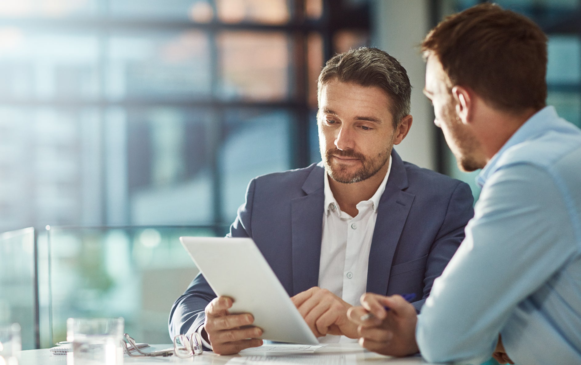 Sales associate explaining Chevy financing options to a customer